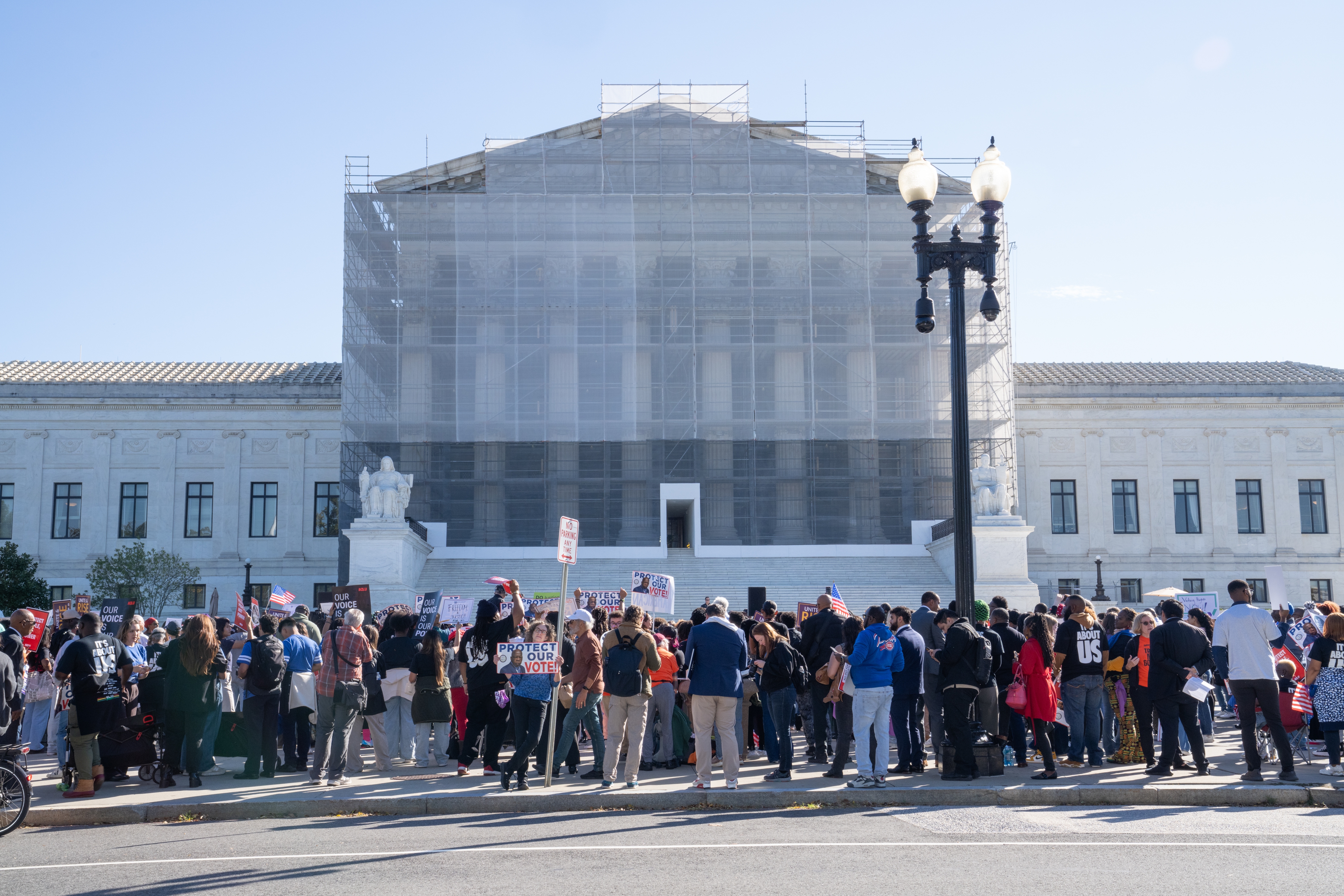 People gather  in support of minority voting rights outside the U.S. Supreme Court in Washington, D.C., on Wednesday.